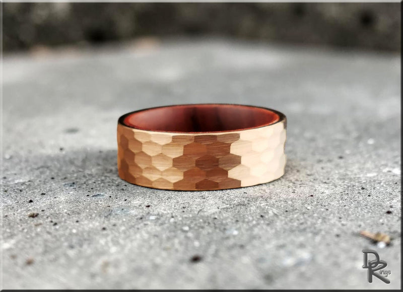 Copper textured ring on concrete surface to shop deals on unique jewelry collections