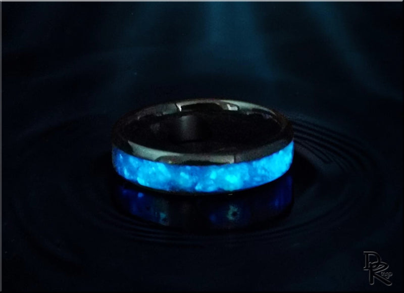 Black band ring with a bright blue glowing inlay from glow rings collection