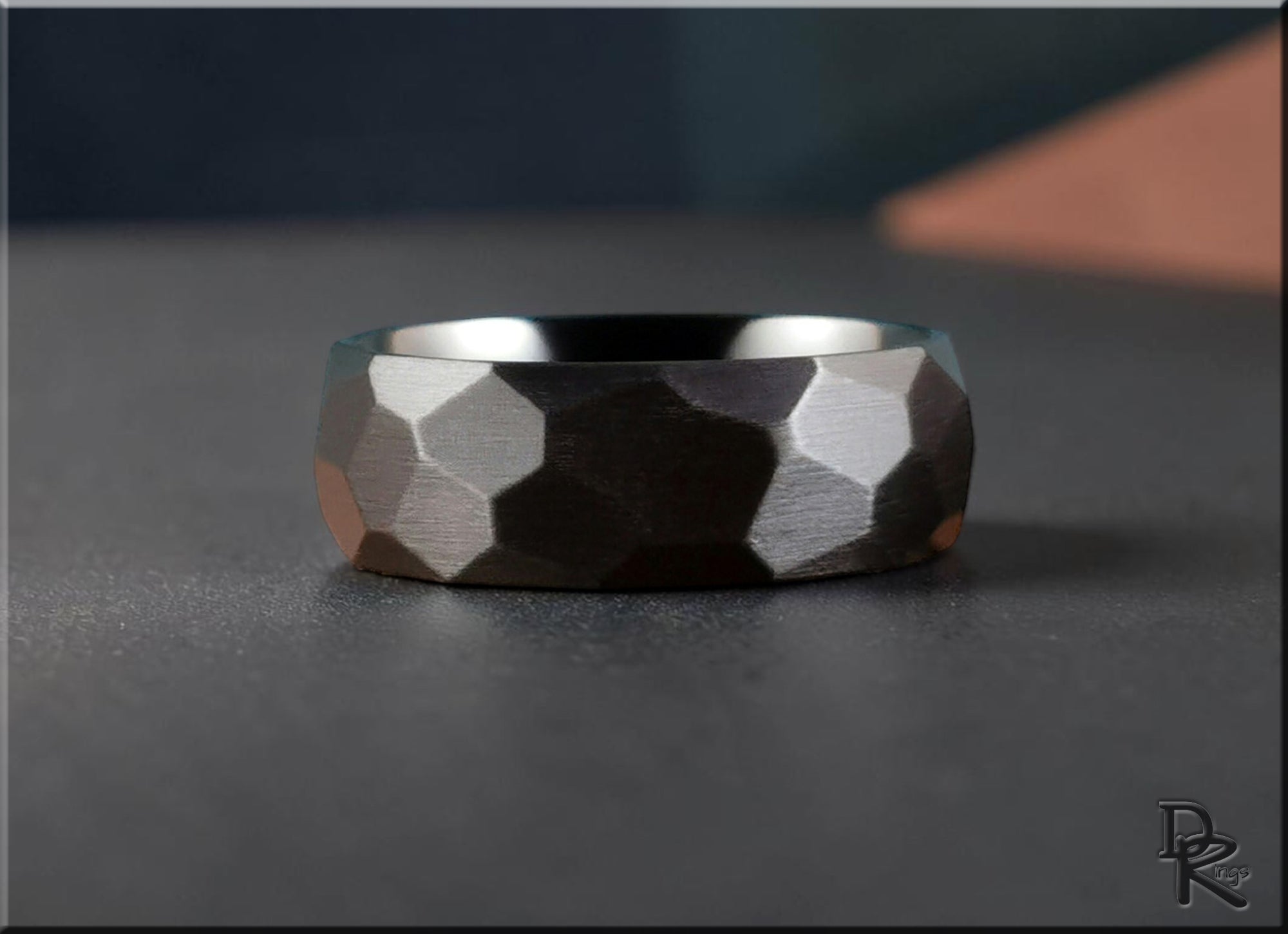 Close-up of a geometric textured metal ring from the just metal rings collection by DR Rings
