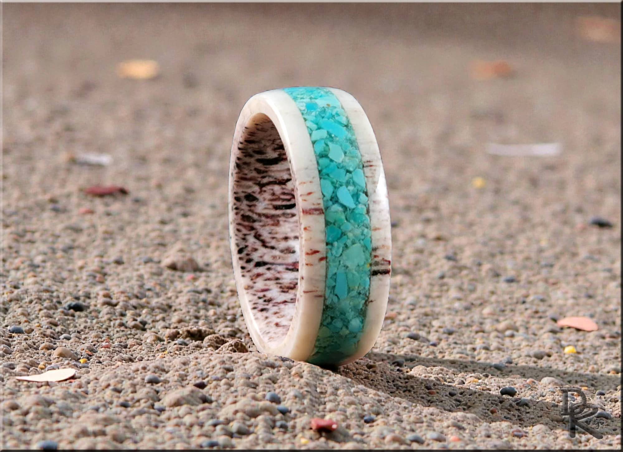 Antler ring with turquoise inlay featuring natural antler texture and vibrant turquoise stones