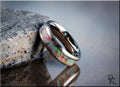 DR Rings titanium ring with inlay featuring colorful opal design on a reflective surface
