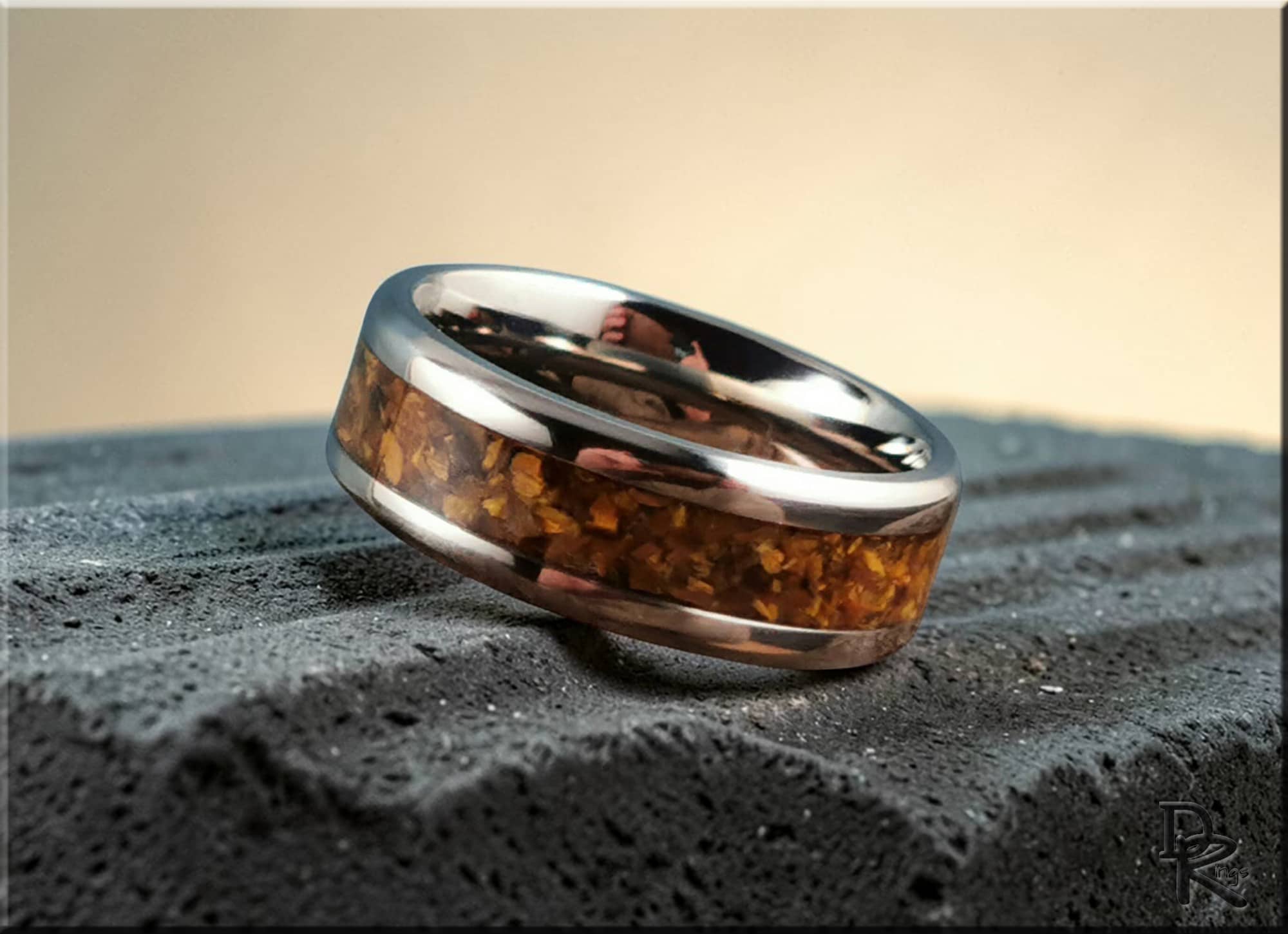 DR Rings titanium ring with inlay featuring a polished metal band and amber stone inlay