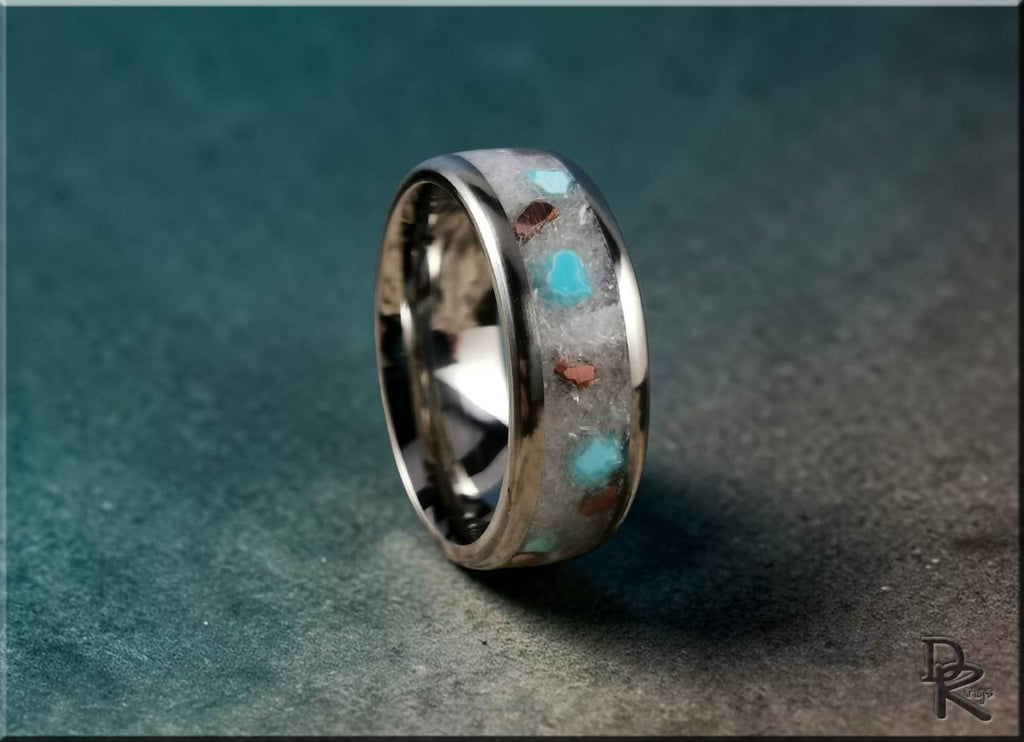 DR Rings titanium ring with inlay featuring turquoise and brown accents on a dark background