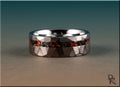 DR Rings tungsten as a ring with faceted silver band and embedded red and black stone inlay