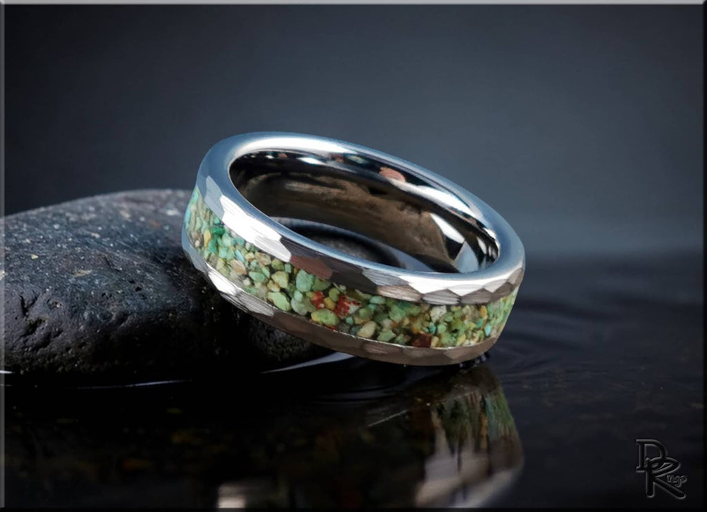 DR Rings tungsten as a ring with green stone inlay and polished silver finish on dark surface