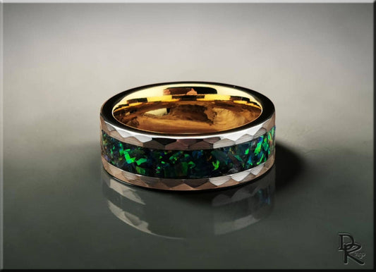 DR Rings tungsten ring with green opal channel inlay and polished silver edges on reflective surface