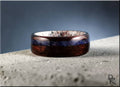 DR Rings elegant wood ring with inlay featuring dark brown and blue tones on textured surface