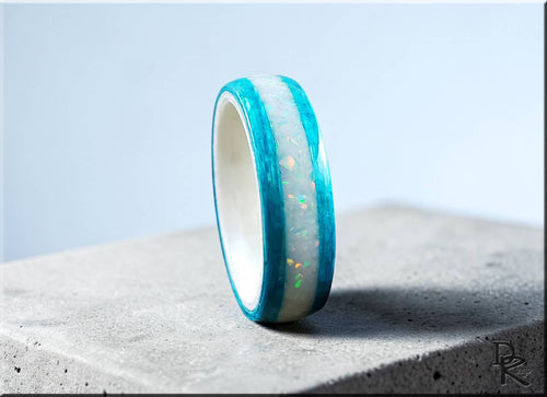 DR Rings wood ring with opal inlay featuring turquoise blue wood and glowing opal center band