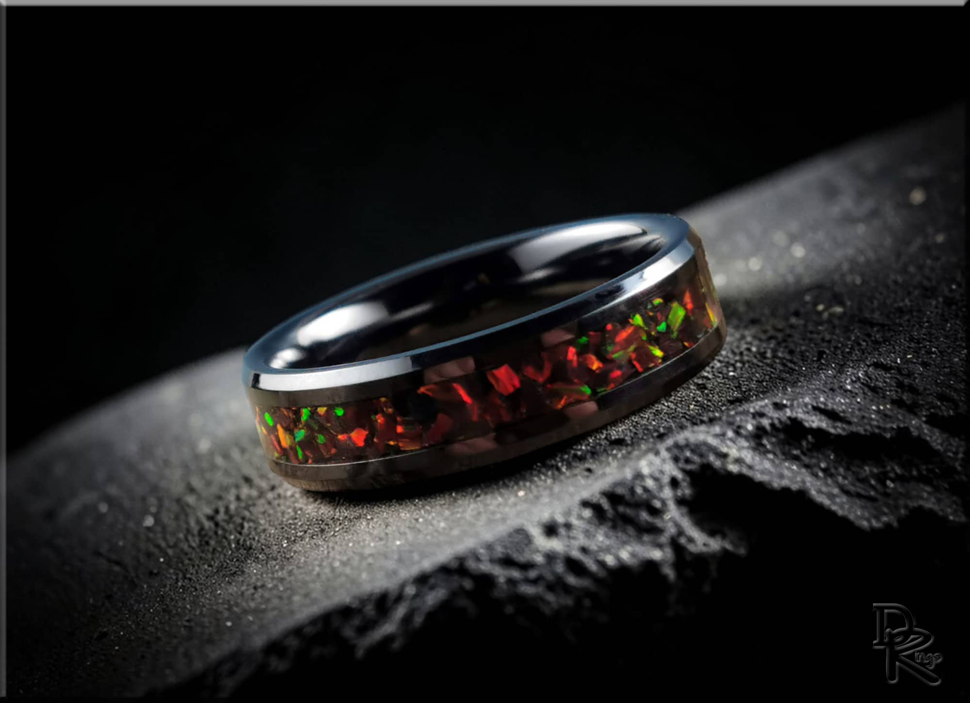 DR Rings ceramic ring with opal featuring vibrant red and green opal inlay on black ceramic band