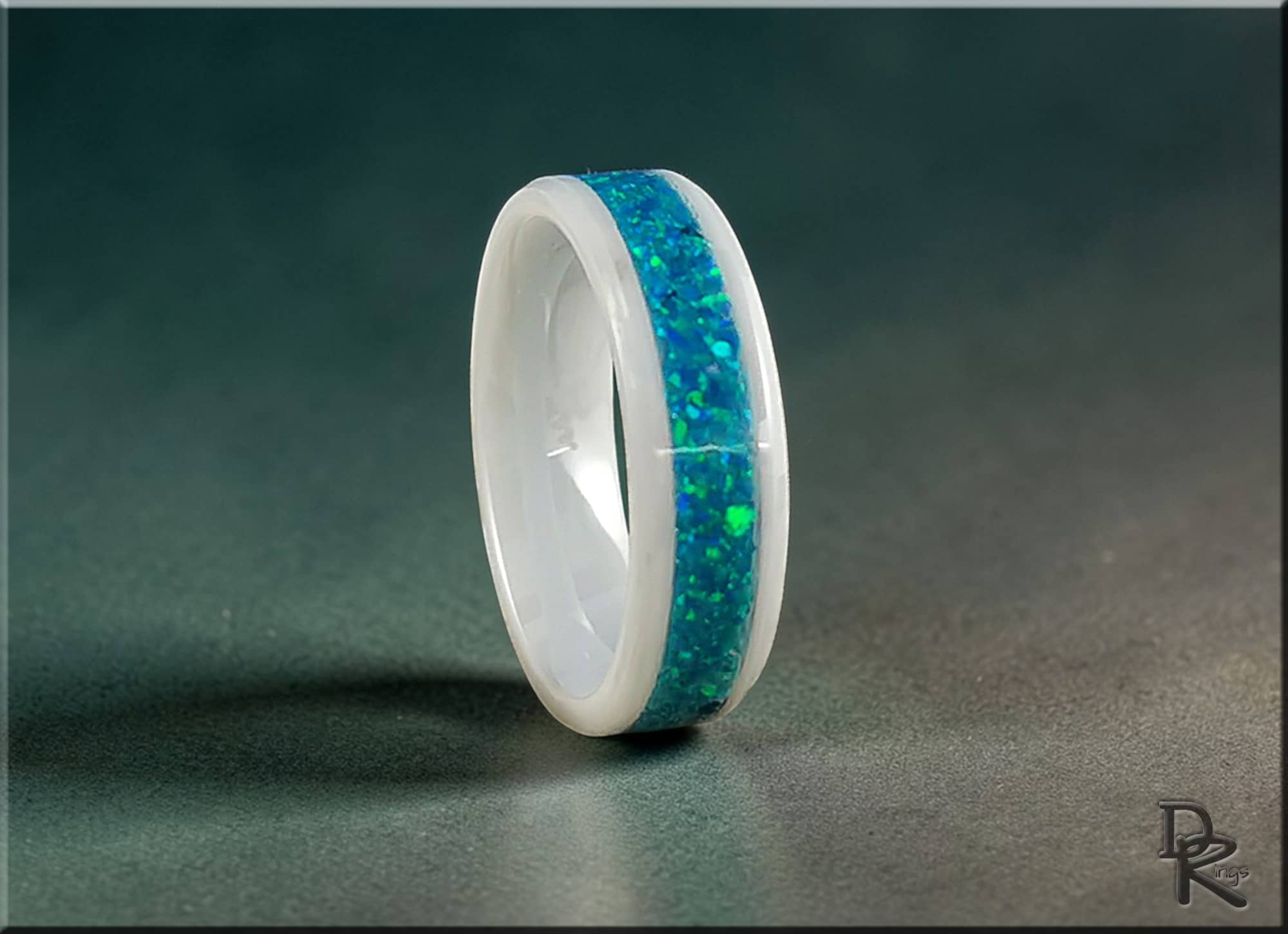 DR Rings ceramic ring with opal inset featuring vibrant blue and green opal pattern