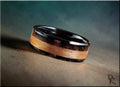 Black Ceramic Ring with Rustic Chestnut and Velociraptor Dinosaur bone inlays