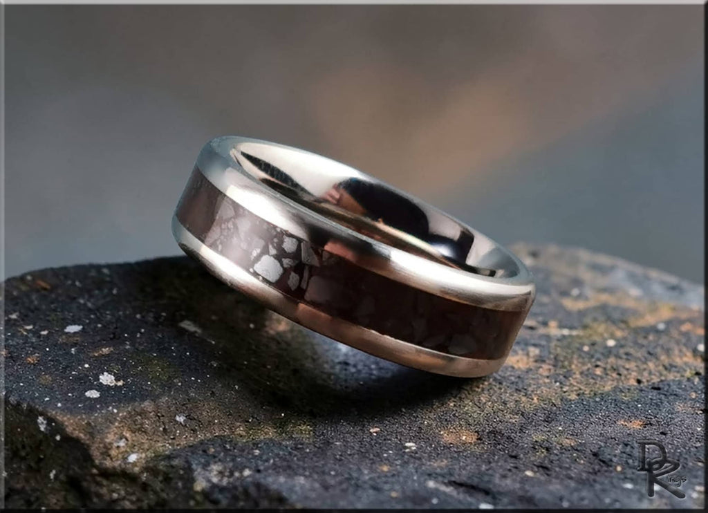DR Rings titanium smart ring with polished silver edges and dark carbon fiber inlay on stone surface