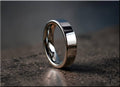 DR Rings polished tungsten ring carbide with smooth reflective surface on textured background