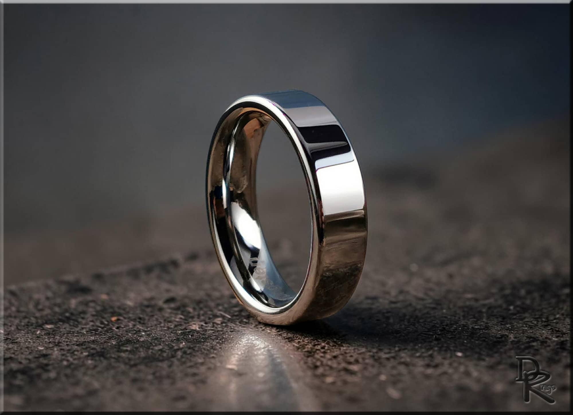 DR Rings polished tungsten ring carbide with smooth reflective surface on textured background