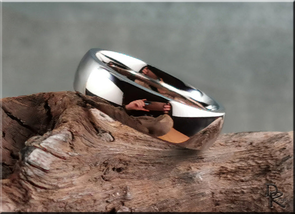 Domed cobalt ring by DR Rings with a smooth polished finish displayed on natural wood