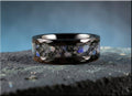 Hammered ceramic ring with inlay featuring a polished black band and blue stone accents by DR Rings