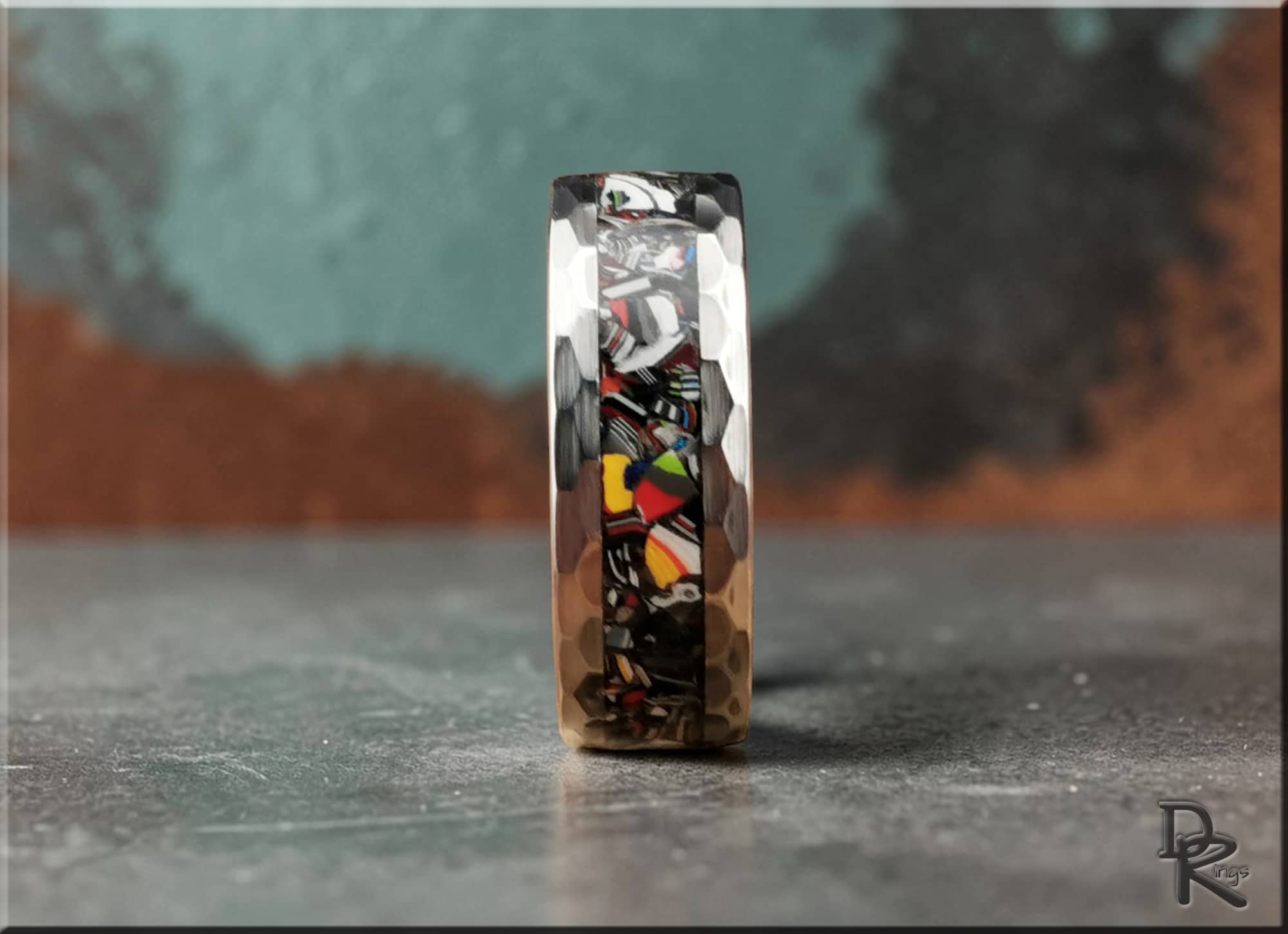 DR Rings tungsten as a ring with hammered silver edges and colorful mosaic inlay design