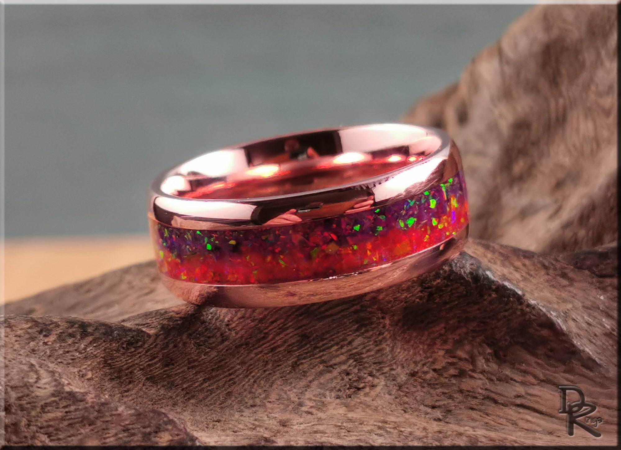 Brushed tellurium copper ring with opal featuring a vibrant red and green opal inlay on a polished copper band