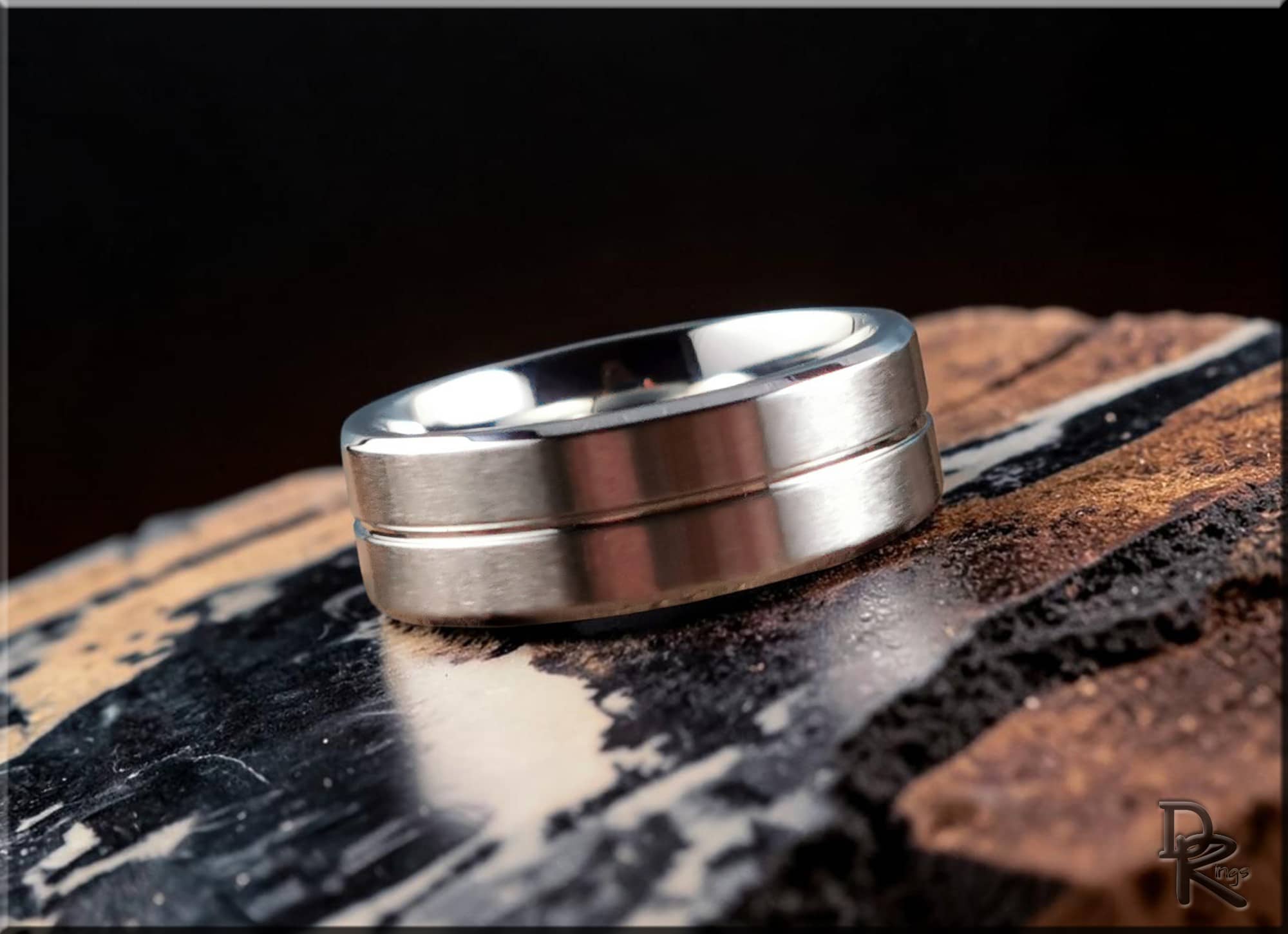 DR Rings polished cobalt ring with modern brushed design on textured surface