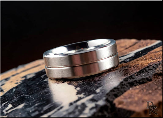 DR Rings polished cobalt ring with modern brushed design on textured surface