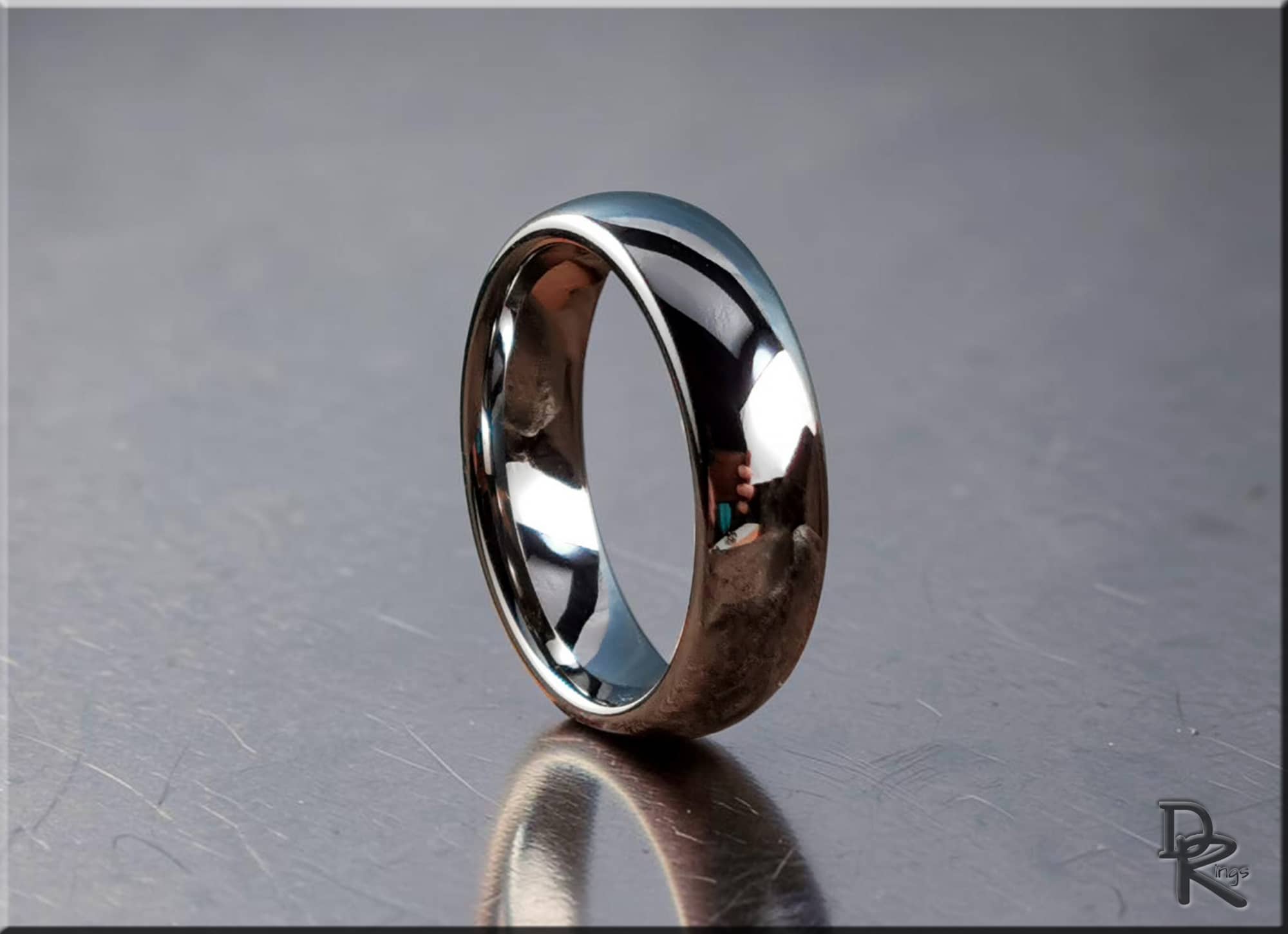 DR Rings polished domed tungsten ring with high shine reflective surface on metallic background