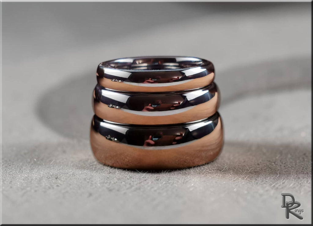 Stack of polished domed tungsten ring bands with reflective surface by DR Rings