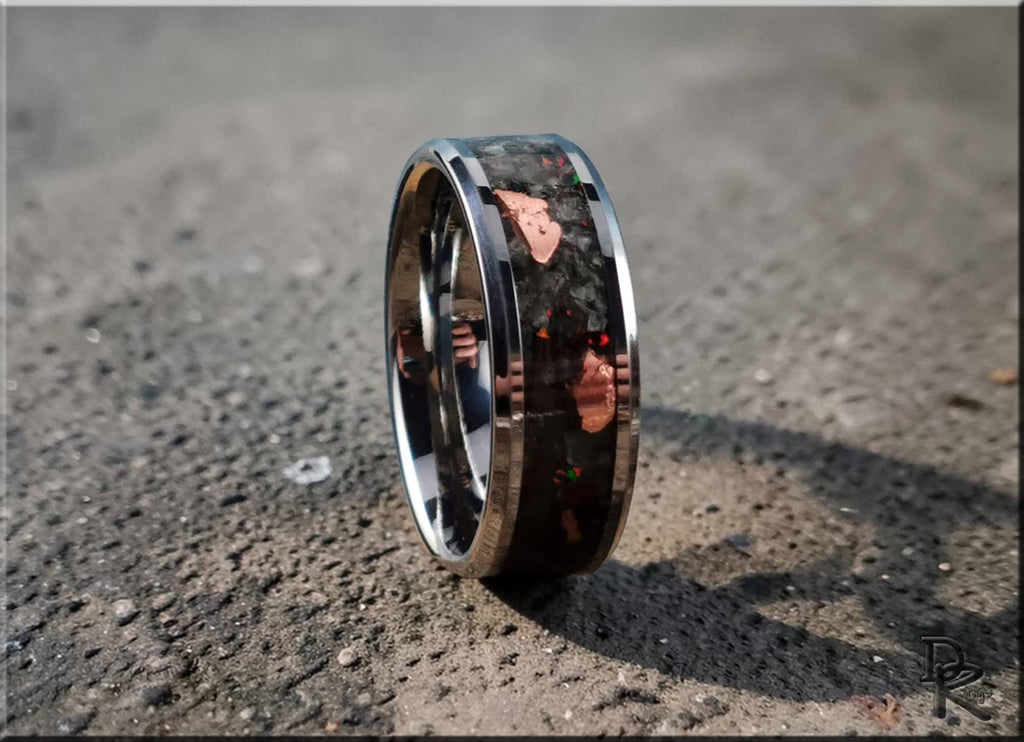 DR Rings tungsten ring carbide with yooperlite featuring a polished black and metallic design on textured surface