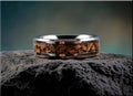 DR Rings tungsten ring with dinosaur bone inlay featuring a polished silver band and unique brown fossil details