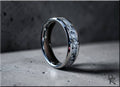 Tungsten ring with moonstone inlay featuring a polished silver edge and speckled gray pattern
