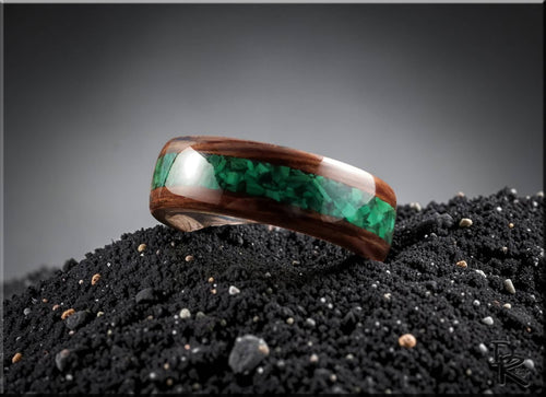 DR Rings wooden band featuring ancient bog oak with malachite inlay on black textured surface