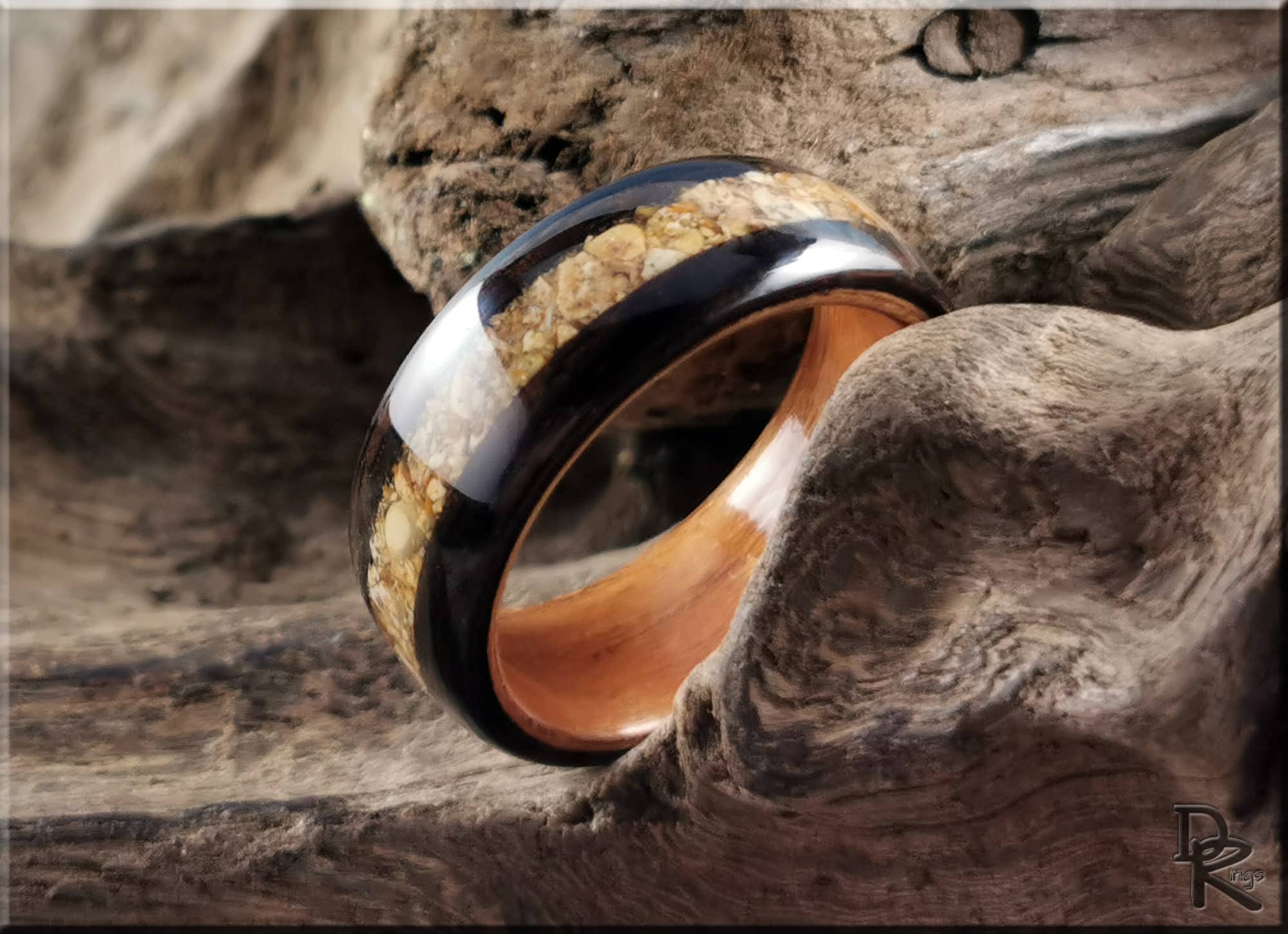 DR Rings wood and resin ring displayed on rustic wood showing how to get rid of water ring on wood
