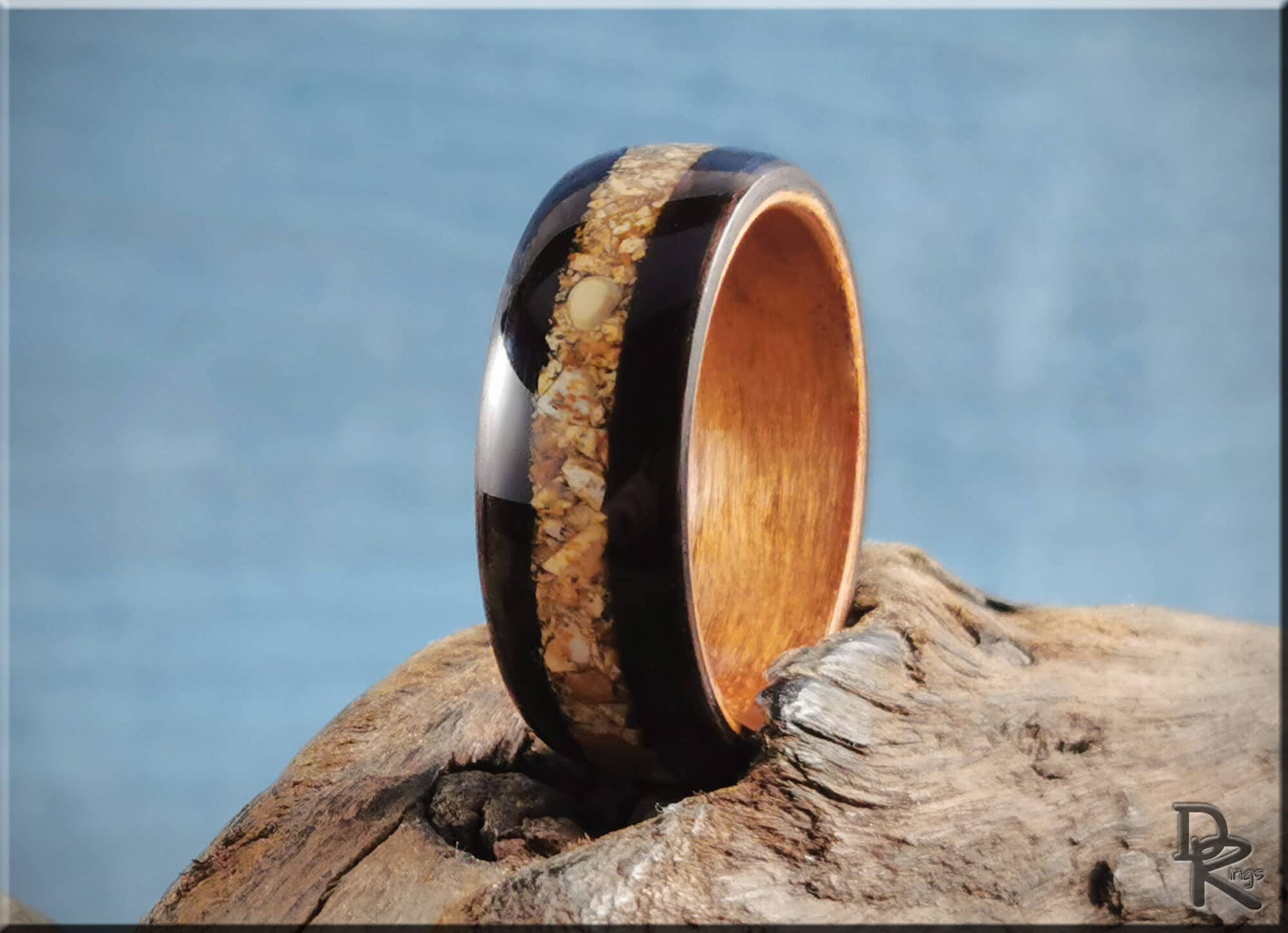 DR Rings wooden ring with natural inlay on rustic wood illustrating how to get rid of water ring on wood