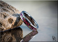DR Rings polished silver band ring opal inlay with vibrant red and green colors on rock by water
