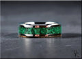 DR Rings tungsten ring with green malachite inlay on gray surface with polished silver edges