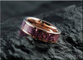 Rose tungsten ring with german glass featuring vibrant purple inlay on a reflective surface