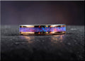 Rose tungsten ring with opal inlay by DR Rings displaying vibrant blue and purple opal hues