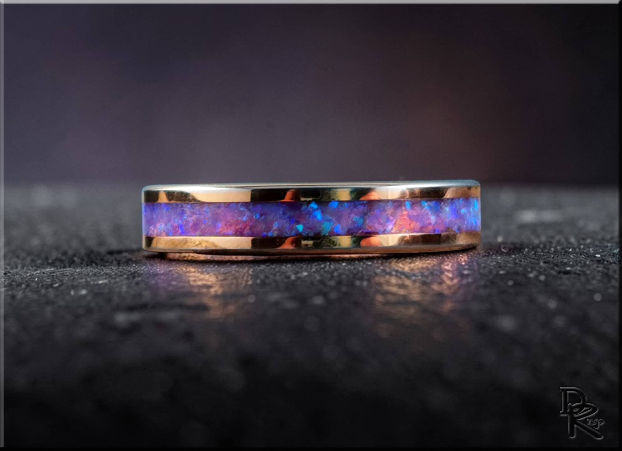 Rose tungsten ring with opal inlay by DR Rings displaying vibrant blue and purple opal hues