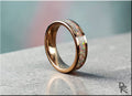 Rose gold tungsten ring with opal inlay featuring a polished finish and vibrant colorful opal stones