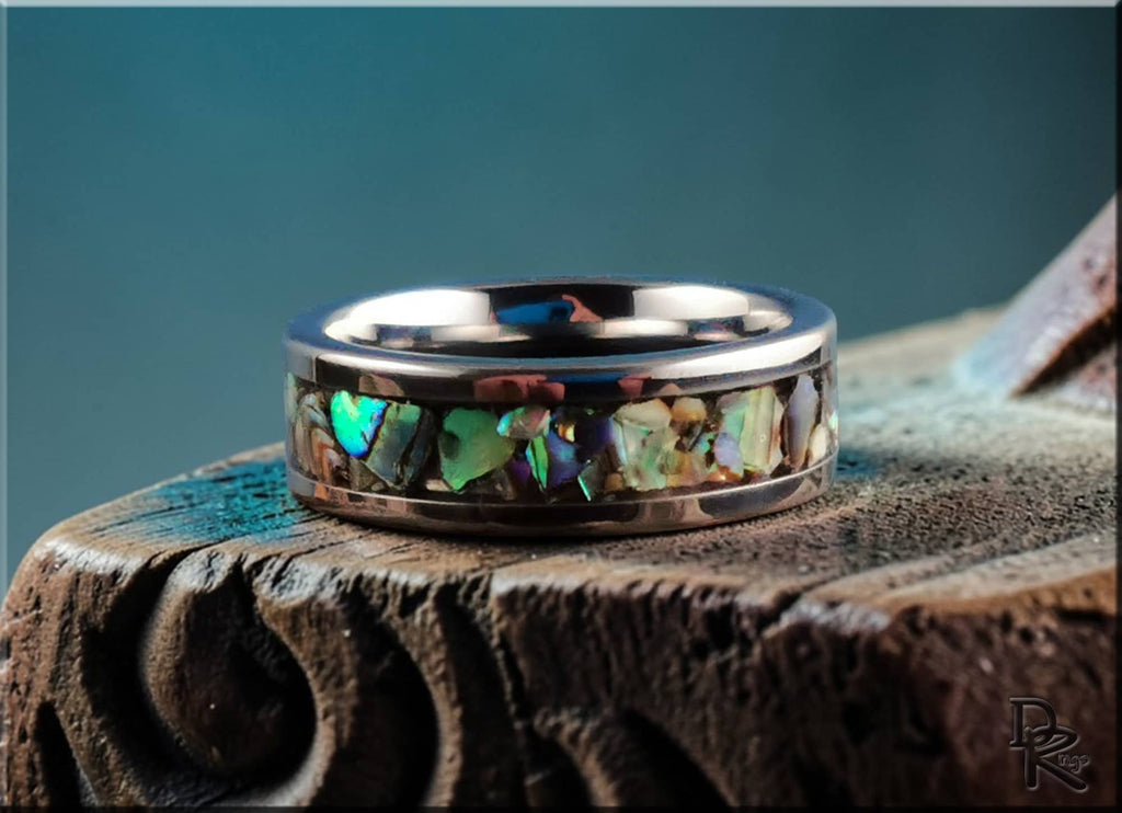 DR Rings titanium ring with abalone inlay featuring a polished silver finish and colorful shell accents