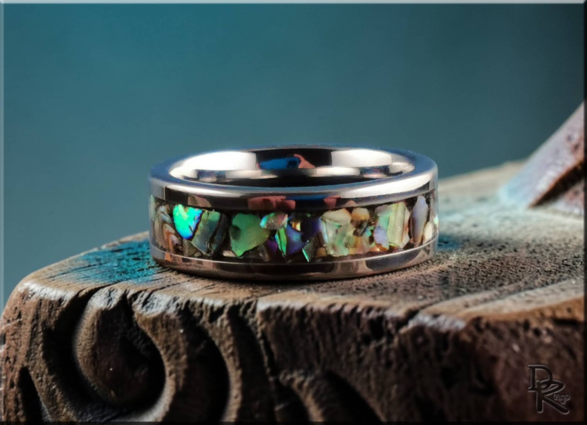 DR Rings titanium ring with abalone inlay featuring a polished silver finish and colorful shell accents