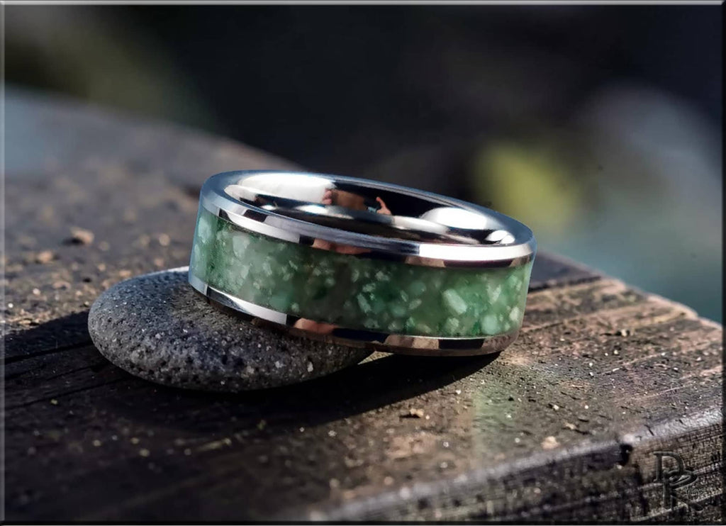 DR Rings tungsten carbide ring with inlay featuring green stone design on wooden surface