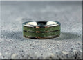 Tungsten ring carbide with emerald inlay by DR Rings featuring polished silver edges and green stone center