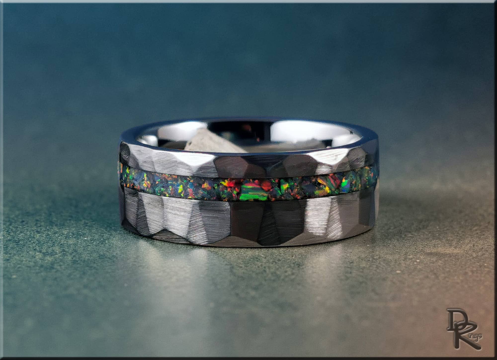 DR Rings tungsten ring with opal inlay featuring a faceted design and colorful opal center strip