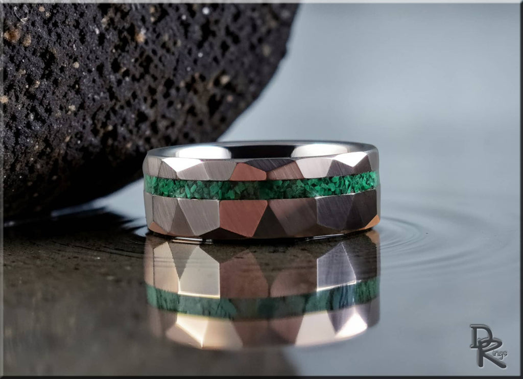 Hammered tungsten ring with malachite green inlay by DR Rings on reflective surface