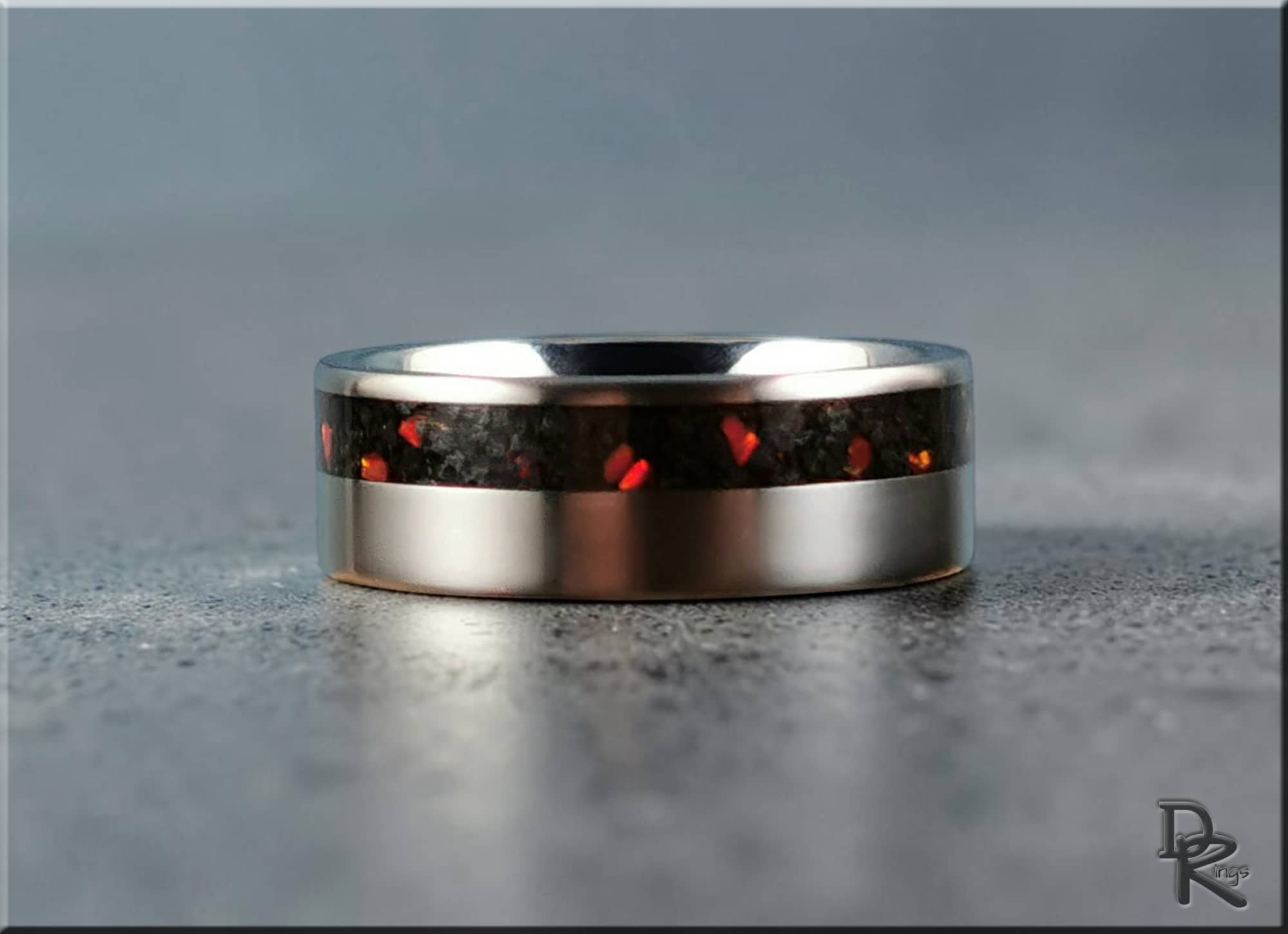 DR Rings titanium ring with inlay featuring black and red textured design on silver band
