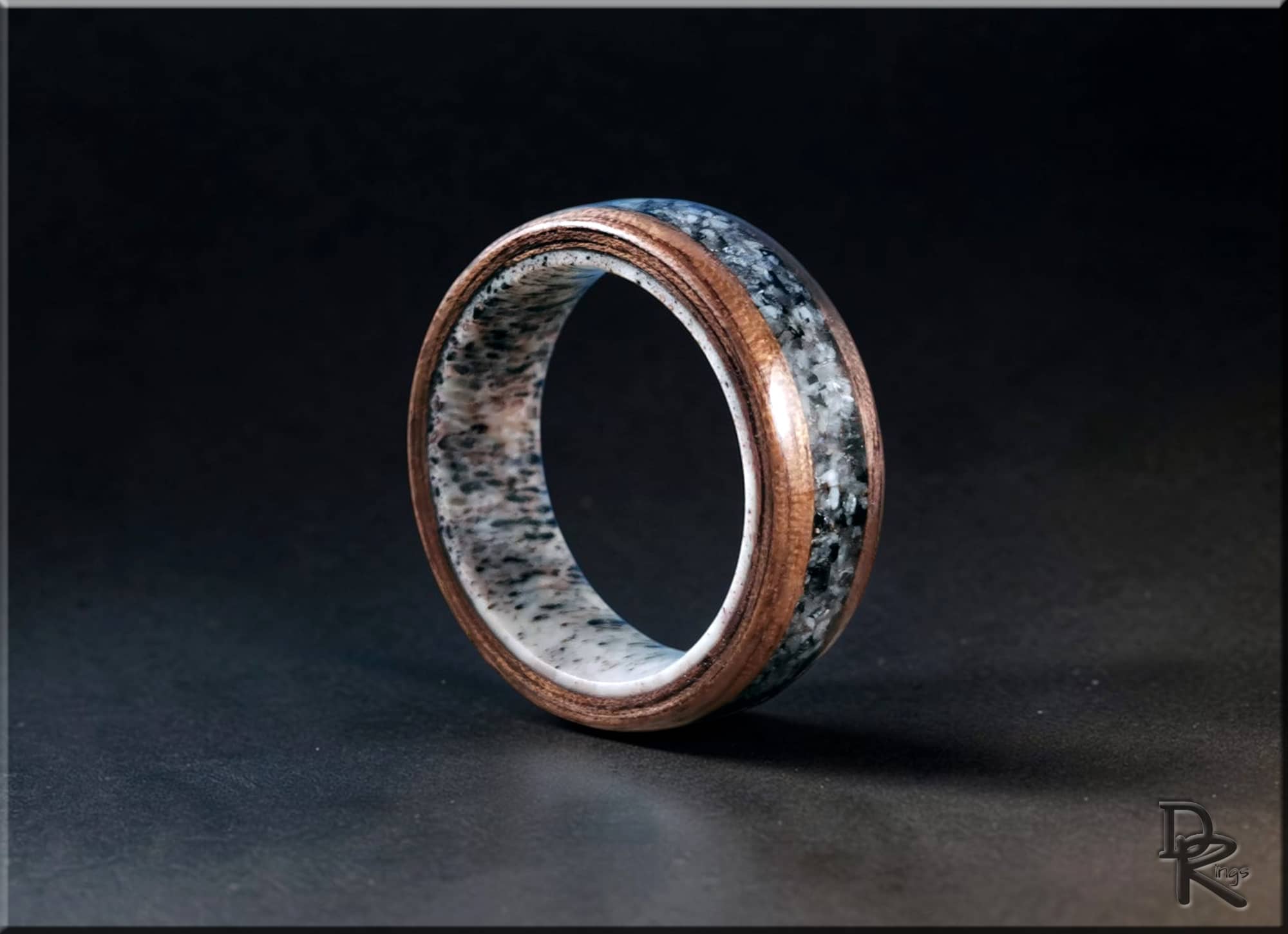 Walnut wood ring with with inlay on antler core by DR Rings against black background