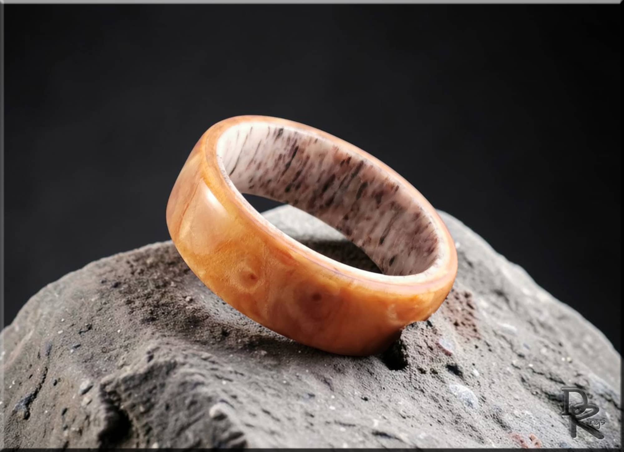Wood ring on antler core by DR Rings with smooth polished wood exterior and textured antler interior