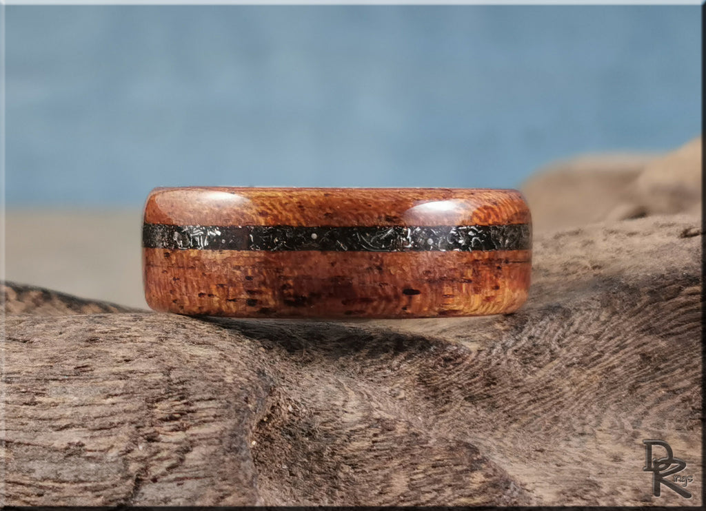 DR Rings wood ring with meteorite inlay on deer antler core displayed on textured wood surface