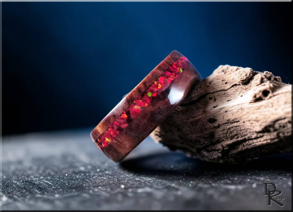 Wood ring with opal inlay featuring vibrant red opal embedded in rich brown wood by DR Rings