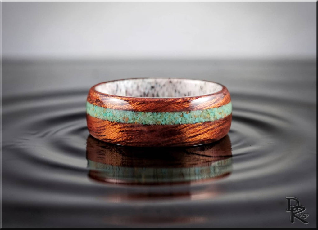 Wood ring with turquoise and antler featuring polished wooden band with turquoise inlay and white antler interior